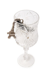 Fototapeta na wymiar Apartment keys and Eiffel Tower keychain in glass. Isolated items on white background