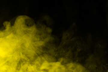 Yellow steam on a black background.