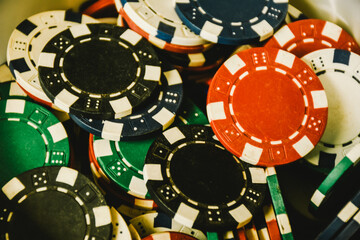 Close up of different color casino poker chips background. Close up of colorful poker chips. 
