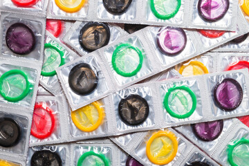 Colorful condoms background.