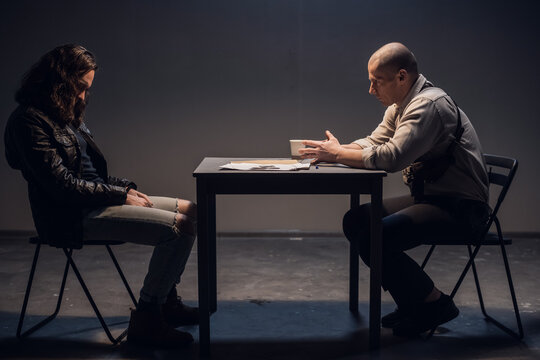 A police detective suspects a white man of committing a crime. Conducts an interrogation with the presentation of evidence in the interrogation room