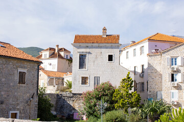 Obraz premium Old city. White stone houses on a sunny day. Montenegro, Budva