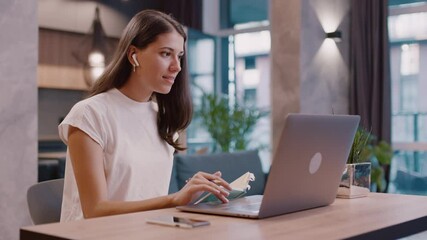 Busy beautiful female student study from home with online teacher lessons. Attractive woman communicating online writing notes learning language distant courses training. Education concept. - Powered by Adobe