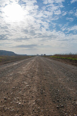 Naklejka premium Country road on a cloudy day
