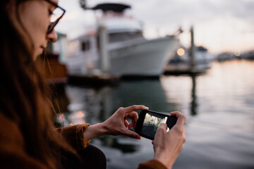 Young woman using phone outdoors