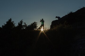 young people taking pictures in the Natural Park of Hoces del Rio Duraton in Segovia Spain at sunset