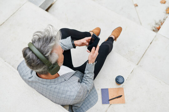 Businessman sitting outside taking a break