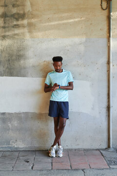 Fit young man checking his running time