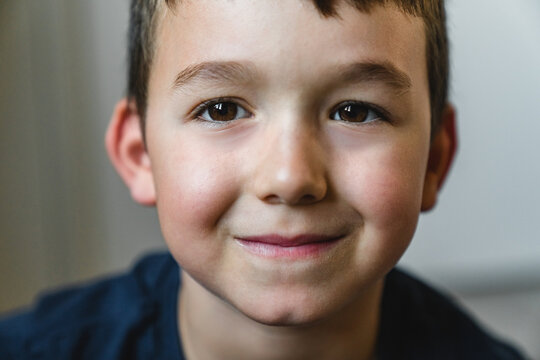 Glad boy looking at camera