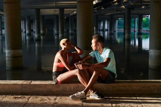 Couple taking a break from jogging