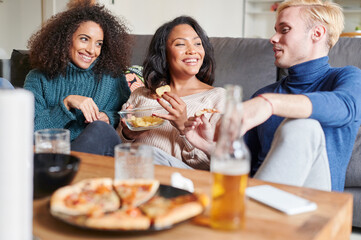 Friends hanging out together at home