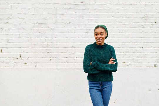 Teen girl smiling while standing outside