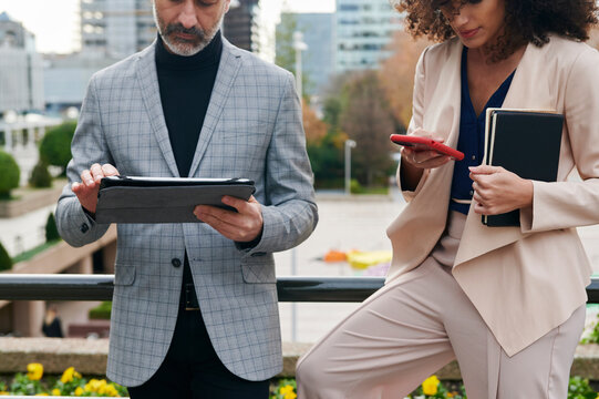 Two businesspeople working outside