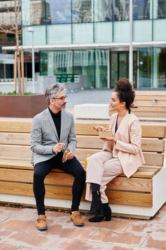 Businesspeople talking outside at lunch