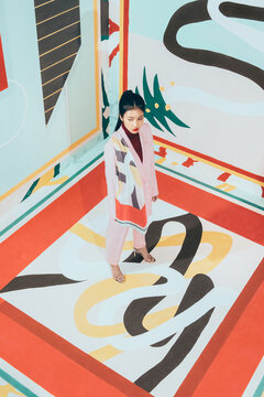 Fashion Model in colorful abstract space .