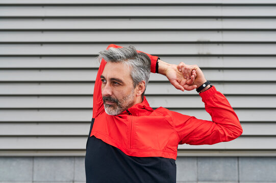 Man stretching before an urban run