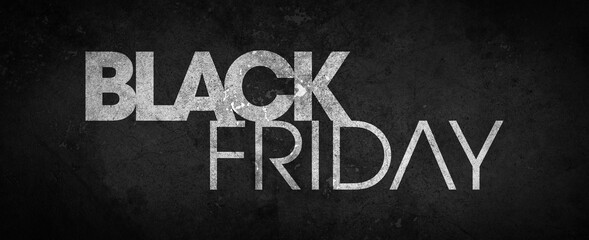 Fototapeta premium Black Friday inscribed in white on a black textured background - black grunge cement texture - high resolution background