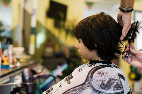 Eight year old boy having a haircut