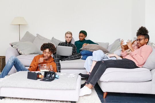 Teenagers hanging out at home