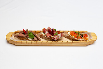 Canapes on a wood plate finger food party food catering 