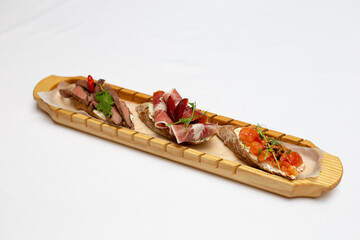 Canapes on a wood plate finger food party food catering 