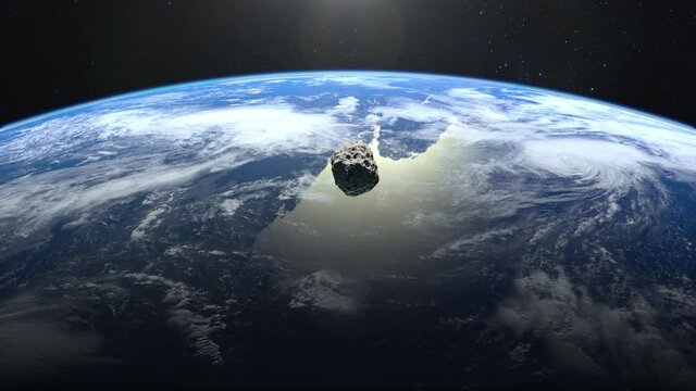 The asteroid falls to Earth. An asteroid appears in the frame, rotates and quickly flies towards Earth. Starry sky. 4K. Stars twinkle. 3d rendering.