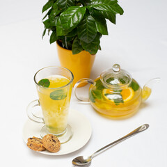 Yellow tea teapot mint and orange tea 