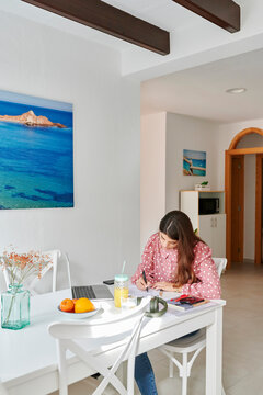 Woman going over paperwork at home