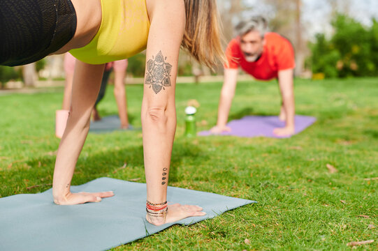 Yoga Instructor Leading A Class Outside