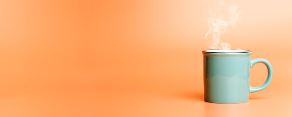 Cup minimal concept. Cup with hot coffee or tea on a blank colored banner background.