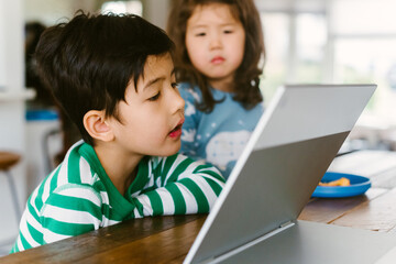 Little kid looking at computer
