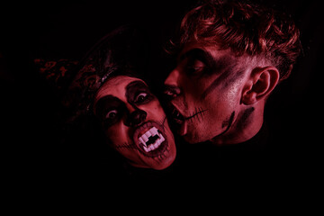 Halloween loving couple with skull makeup. Halloween photo. Couple in love. Dark. Horror. 