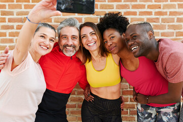 Sporty friends taking selfies together