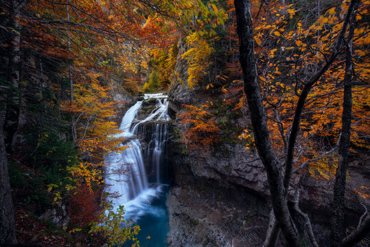 Waterfall in a forest at autumn