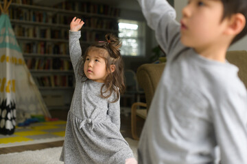 Kids doing yoga at home