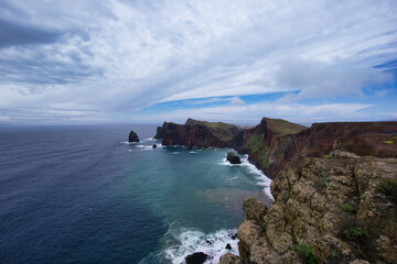 Fototapeta na wymiar View at the blue ocean and red volcanic cliffs at the Ponta de São Lourenço in Madeira / Portugal 
