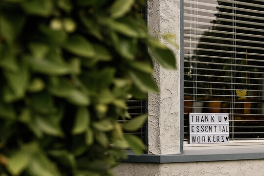 Thank you essential workers"" sign in window