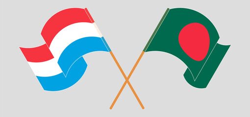 Crossed and waving flags of Bangladesh and Luxembourg