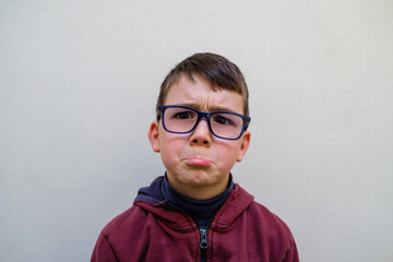 Upset boy looking at camera