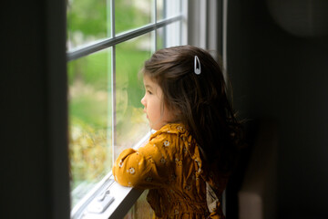 Child looking out the window