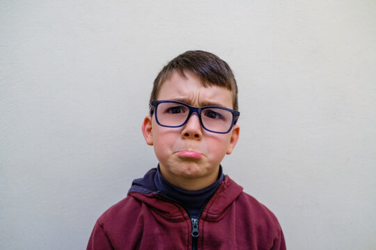 Upset boy looking at camera