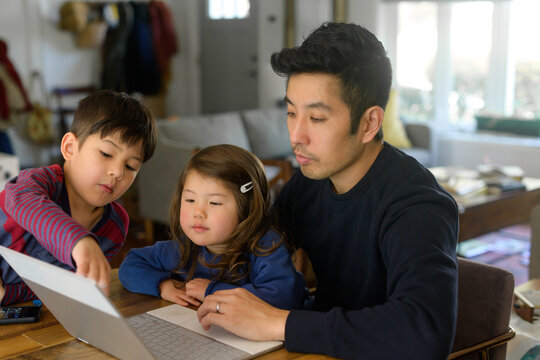 Dad And Kids On Computer