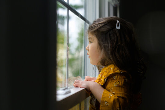 Child looking out the window