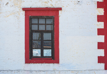 Fototapeta na wymiar old window on red wall