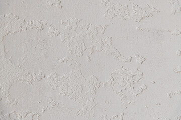 Abstract textured background. Close up view of concrete wall  covered with gray plaster. Copy space for your text.