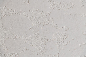 Abstract textured background. Close up view of concrete wall  covered with gray plaster. Copy space for your text.