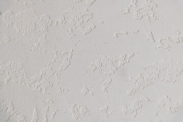 Abstract textured background. Close up view of concrete wall  covered with gray plaster. Copy space for your text.