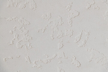 Abstract textured background. Close up view of concrete wall  covered with gray plaster. Copy space for your text.