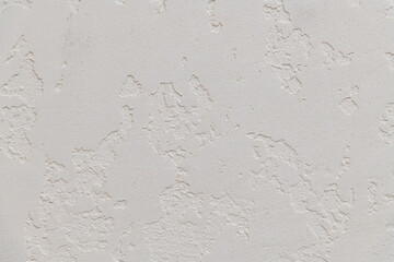 Abstract textured background. Close up view of concrete wall  covered with gray plaster. Copy space for your text.