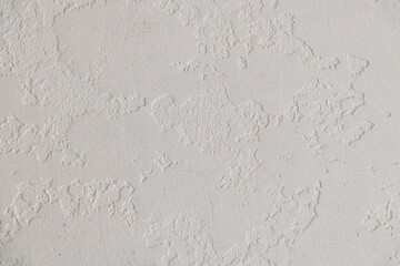 Abstract textured background. Close up view of concrete wall  covered with gray plaster. Copy space for your text.